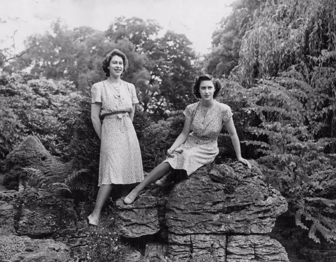 Their Royal Highnesses Princess Elizabeth and Princess Margaret in the rock gardens at Royal Lodge, Windsor. March 24, 1947.