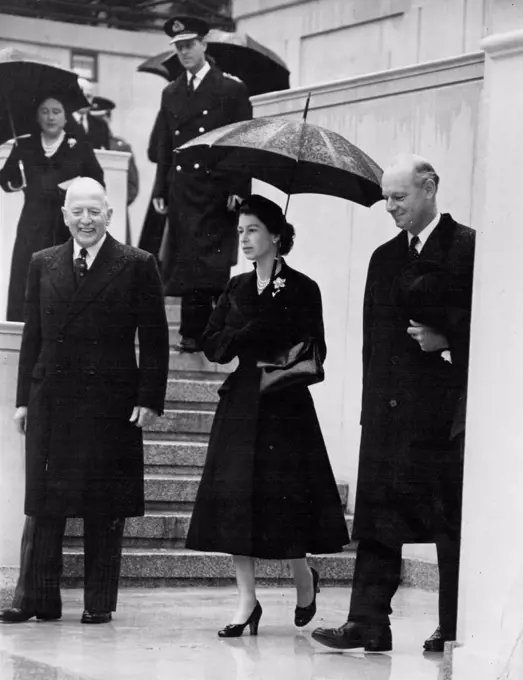 The Queen Unveils Statue Of King Geoege VI -- The Queen photographed at the unveiling ceremony today. In pouring rain the Queen today unveiled the National Memorial to her father, King George VI, in Carlton Gardens overlooking the Mall. She was accompanied by the Duke of Edinburgh. Also present at the ceremony were the Queen Mother, Princess Margaret, the Duke and Duchess of Gloucester, the Duchess of Kent, and members of the Government and members of Parliament. October 21, 1955. (Photo by Daily Mirror).