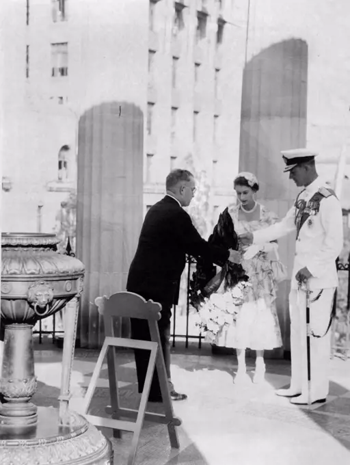 It was a solemn moment for the Queen as she placed a wreath on the Shrine of Remembrance. March 19, 1954.