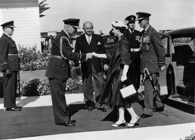 Royal Tour Victoria. The Queen and the Duke of Edinburgh as Marshal of the Royal Air Force welcomed at the R.A.A.F. Station Point Cook. From left Air Marshal Macaulay and the Minister for Air Mr. McMohon. March 12, 1954.