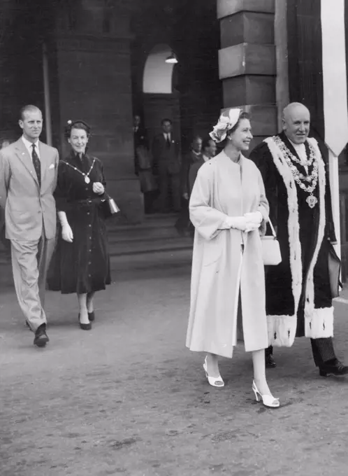 Queen Elizabeth and the Duke of Edinburgh on arrival at Dunedin (NZ) Railway Station. With them is the Mayor of Dunedin, Mr. L. M. Wright and his wife.February 04, 1954.