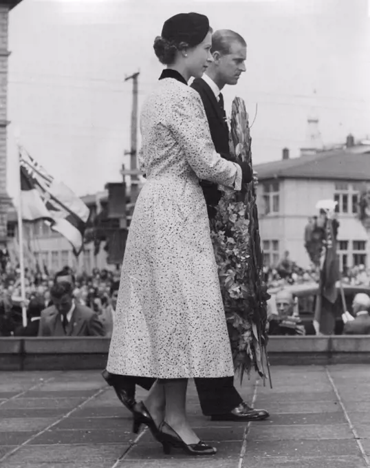 Queen and Duke of Edinburgh laying a wreath on the War Memorial shortly after their arrival in Wellington, New Zealand. January 14, 1954.