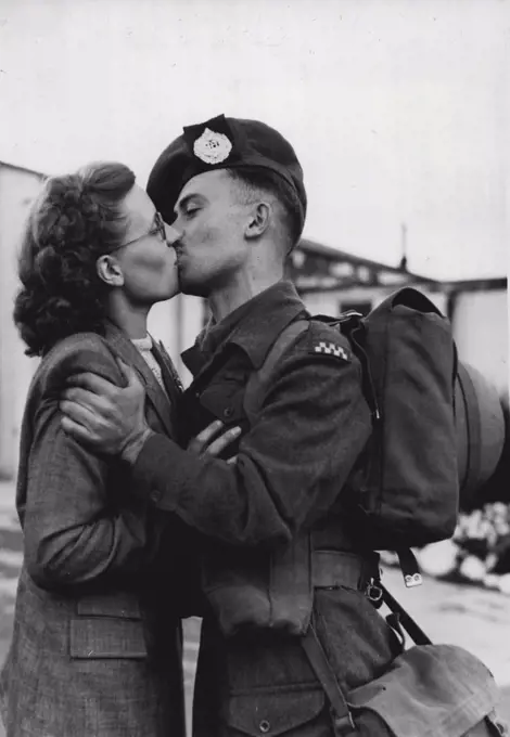 A Kiss Before Korean Flight - A last embrace and kiss between Private Godfrey Gethen and his wife, Maisie, of Nottingham, before the soldier boarded an airport here to fly to Korea in company with two officers and 63 men of the Argyll and Sutherland Highlanders. Blonde, and 22, Mrs. Gethen had travelled down from her home to see her husband off. Until a few months ago most of the men were serving with the Boar in Germany. Nearly all of them had volunteered for service in Korea. September 15, 1950. (Photo by Planet News Ltd.). 