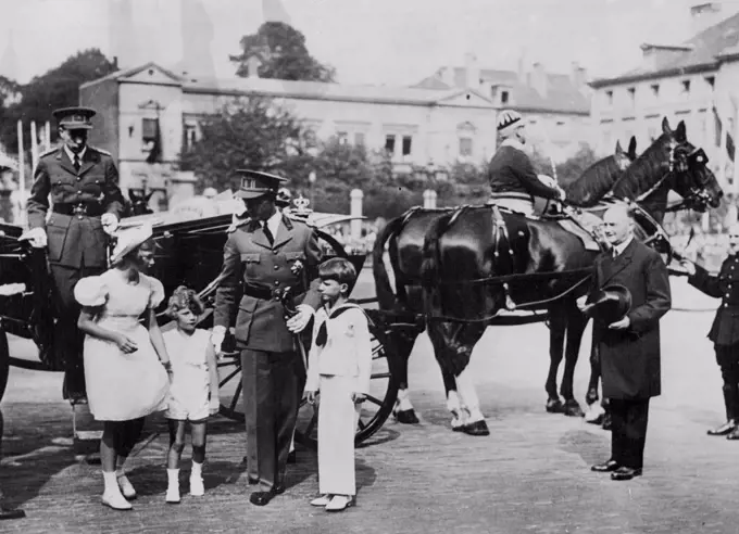 King Leopold And Family Watch Parade -- King Leopold of the Belgians chats to his children, Princess Josephine Charlotte, Prince Albert of Liege and Crown Prince Baudouin as they got out of their carriage on arrival at the Place Poelar in Brussels to witness the great Parade in connection with the National fete in Belgium. Prince Charles, brother of the King is seen getting out of the carriage. July 23, 1938. (Photo by Keystone).