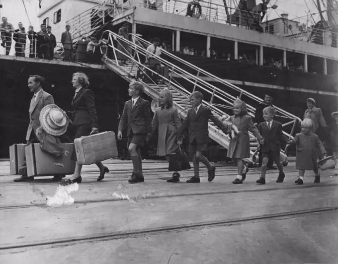 A typical British migrant family comes ashore. Migration: "Migrants are pouring in and the work force is building up rapidly...". Sunshine versus Vietnam A British migrant family steps into Australia. November 17, 1955. 