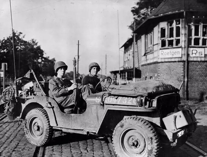 Americans Pierce Siegfried Line In Roetgen AreaThe first American Jeep to cross the German frontier stops at the Railroad Station in Roetgen September 14, 1944. American forces blasted a path through the outer concrete and steel fortifications of the Siegfried line in the vicinity of the German City a few miles inside the border. October 23, 1944. (Photo by Office of War Information).