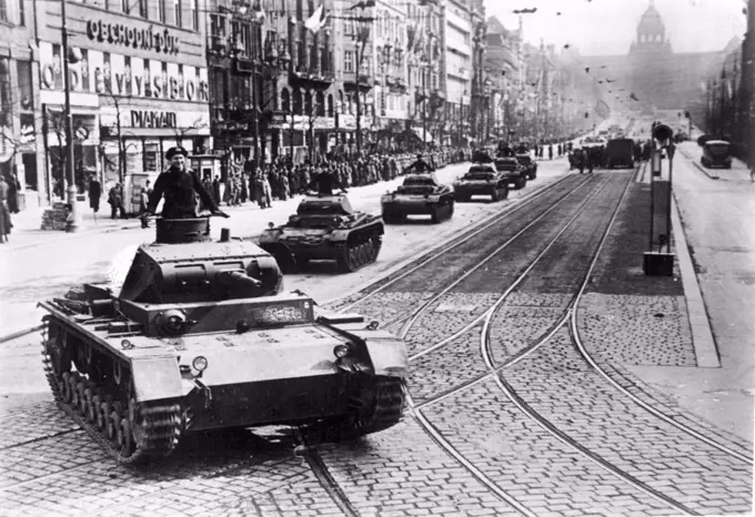 First German parade in Prague -- On Friday (17.3) took General Geyr von Schweppenburg on Wenceslas Square from the first parade dent chef troops in Prague. For half an hour the German tanks rolled all classes in fast ride down the Wenceslas Square. Aided by the good weather, lined a numerous crowd both sides of the square. The audience, which consisted mostly of Czechs was very impressed by the massive spectacle. March 18, 1939. (Photo by Atlantic Photo).