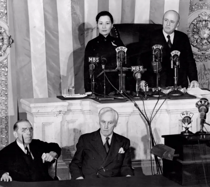 Madame Chiang Kai-Shek Appeals For More Aid -- Before a crowded House Chamber, in her first public appearance, Madame Chiang Kai-Shek appealed to the American people for more aid for China "which has bled and borne unflinchingly the burden of war for more than five and a half years". Madame Chiang is shown as she was introduced by Speaker Samuel Rayburn, right. In the foreground are Rep. Sol Bloom, of N.Y. Chairman of the Foreign relations Committee; Rep. Charles A. Eaton of N.J.; February 18, 1943. 