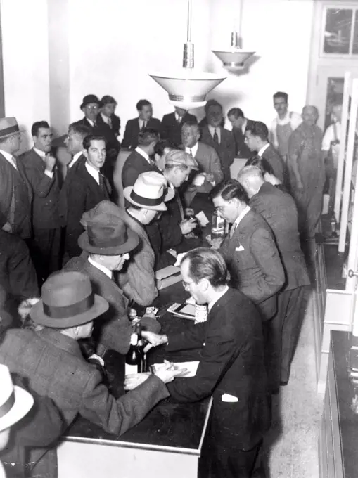 Mark Death Of Dry Era -- This is just part of the crowd that surged into Bloomingdale's, New York department store, December 5, to lay in a supply of wet goods as soon as the news became known that old man prohibition had died a more or less natural death. The new liquor regulations make department store selling of liquor one of the more interesting experiments of another "experiment to end experiments." May 12, 1933. (Photo by Associated Press Photo).