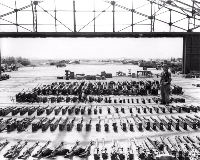 Jap. Weapons.... Confiscated Japanese ***** a hangar at the Tashio Airport, Honshu, a collecting ***** for the Japanese weapons and ammunition. October 13, 1945. (Photo by US Signal Corps Photo).