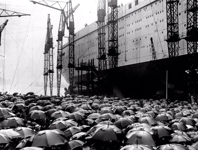 Launch Of The "Queen Mary" -- General view showing part of the huge crowd, under umbrellas, watching the launch of the "Queen Mary". September 26, 1934. (Photo by Keystone).