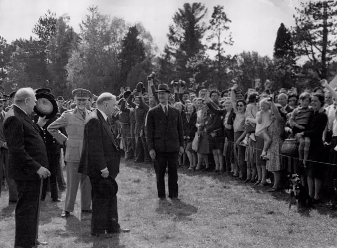 Mr. Churchill And Empire Prime Ministers See Invasion Troops - Mr.Churchill calls for three cheers for the visiting Prime Ministors, Lustily given by the villagers.Mr.Winston Churchill, General Smuts (S. Africa), Mr. MacKenzie King (Canada) and Sir Godfrey Huggins, (S. Rhodesia) saw invasion troops and weapons in 12th May 1944, during a 60 mile tour. Later they were joined by Mr. Peter Fraser. May 01, 1944. (Photo by British Official Photograph).