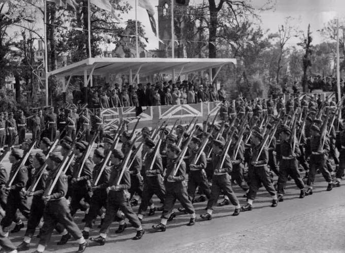 Mr. Churchill Takes Salute At Great Berlin Victory Parade - Men of the 7th Armoured division, the famous "Desert Rats" who fought their way through from El Alamein, march past the saluting base.Mr.Winston Churchill took the salute at a great British victory parade in the heart of Berlin. when 10,000 men from the fighting services merched along the charlottenburger Chaussee, the broad highway which cuts through Berlin's Tiergarten. July 23, 1945.