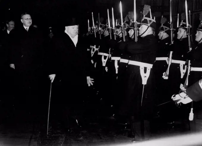 Churchill Arrives in Paris. Reviews Honour Guard. British Prime Minister Winston Churchill reviews the guard of honour at the railway station on arrival here.In the background, from left to right, are; Sir Oliver Harvey, British Ambassador to Paris; British Foreign Minister Anthony Eden, and French Premier Rene Pleven.Eden is accompanying Churchill on his visit to Paris. They are holding talks with French Ministers in preparation for the forthcoming Churchill visit to Truman in Washington next month. December 18, 1951.