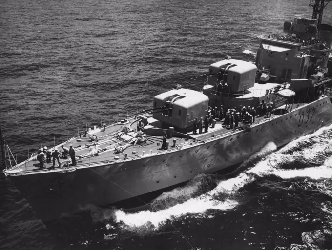 A perfect focal shot of H.M.A.S. Tobruk as she comes alongside Sydney. February 25, 1953.