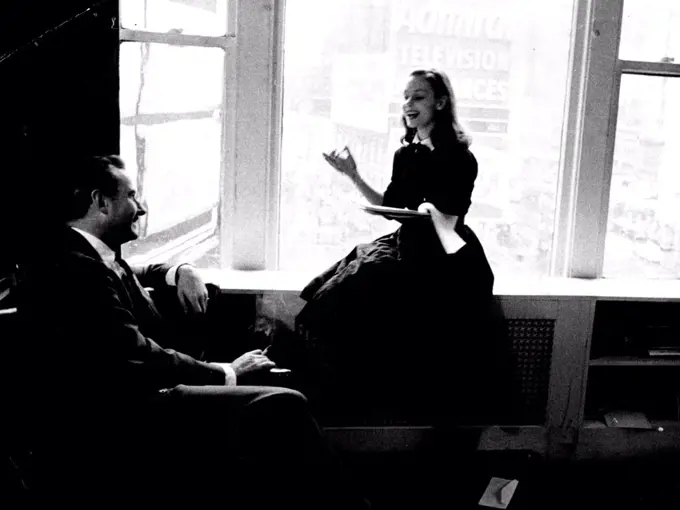 Producer Robert Whitehead smiles his appreciation as Susan reads him a trial script. Although she concentrates hard, she looks relaxed and happy. She likes corny serials. July 8, 1955. (Photo by Look Magazine).