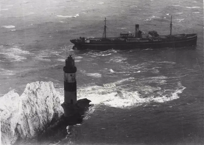 Tugs And Tide Fail To Save Ship Wedged On Rocks.An aerial view taken last night showing the Varvassi still fast on the Needles.The Greek tangerine ship Varvasst, carrying 300 tons of tangerines, went on the rocks at the Needles, Isle of Wight. Lloyds experts are pazzled why the ship, and tugs which had stood by to drag her off abandoned their attempts. Needles Bridge, one of the three dreaded underwater spikes, is a notorious hazard and "there is a lamp-post on the corner" as one mariner described the Needles Lighthouse.  January 6, 1947. (Photo by Keystone).