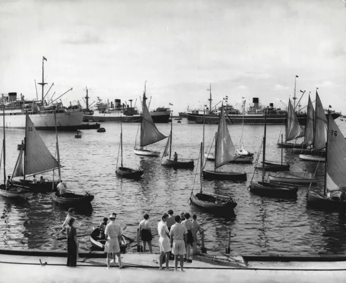 The Royal Tour: Ceylon -- Colombo Harbour: Colombo is the capital of Ceylon and is familiar to all travellers to the Far East and Australia as a port of call. The town lies on the West coast; its artificial harbour was built by the British, the first stone of its 4000 ft. long breakwater having been laid by Edward VII, when he was Prince of Wales. This view of the Harbour was taken from Colombo Yacht Club. In the foreground European city men and their families prepare for a regatta on a Saturday afternoon. In the background, shipping from all parts of the world.The Queen and the Duke of Edinburgh will arrive in, Colombo on 10th April and leave on 13th April, 1954. April 12, 1954. (Photo by Rosemary Gilliat, Camera Press).