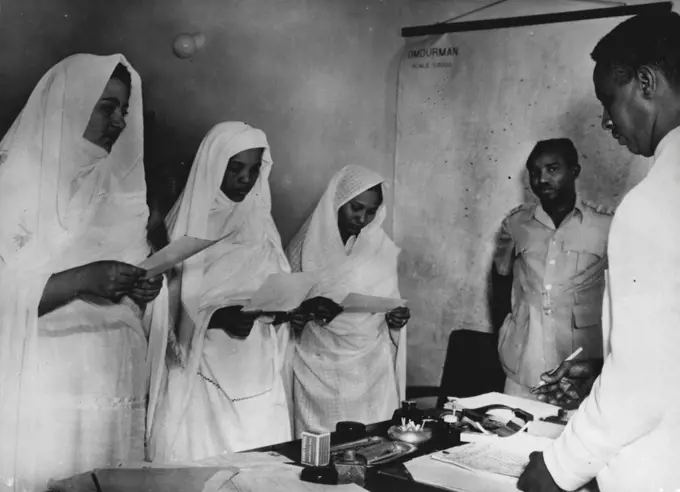 The Sudanese Women May Vote - Women - as women - have no votes in the Sudan. However, the law gives a vote for the graduates' constituency to all Sudanese persons over 21 who possess certain educational qualifications.There are only eight Sudanese women so far qualified, and here are three of them registering their votes in Omdurman for the graduates' constituency.They are Miss Thoraya Ambabi, Miss Amna Ibrahim Malek, and Miss Malthum 'Omar. All three are teachers in Omdurman. December 3, 1953. (Photo by Associated Press Photo).