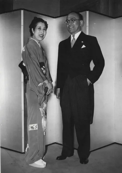 Japanese Ambassador And Wife Give Party -- The Japanese Ambassador to London ad his wife Mr. and Mrs. Shunichi Matsumoto, seen at the Japanese Embassy tonight when they gave a party in celebration of the birthday of the Japanese Emperor. April 29, 1954. (Photo by Peter Skingley, United Press Photo).