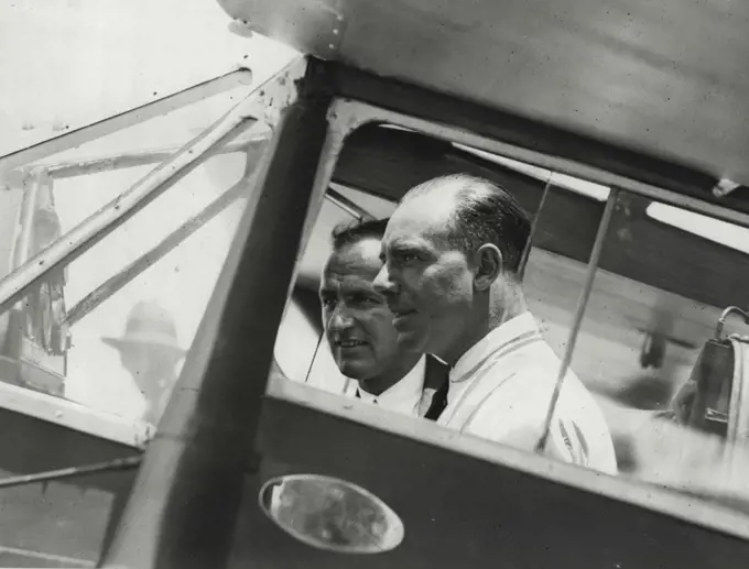 Nine and half days his aim. - Captain Matthews (left) tested his plane at Mascot today for an attempt on Australia - England record. December 19, 1930.