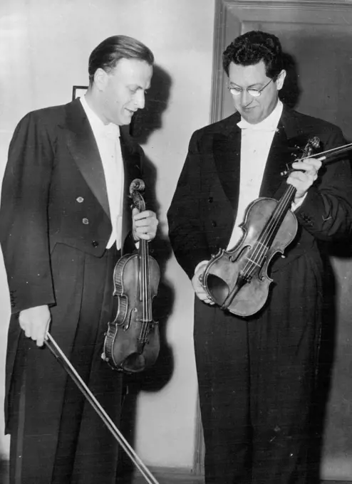 Yehudi Menuhin At Viennese Festival -- Yehudi Menuhin (left) and Professor Wolfgang Schneiderhan in the Vienna concert hall.Highlight of the Vienna festival was the musical performance with star artists Yehudi Menuhin and Professor Wolfgang Schneiderhan playing violin duets and sonatas by Bach, Beethoven and Bartok. June 16, 1953. (Photo by Paul Popper, Paul Popper Ltd.).