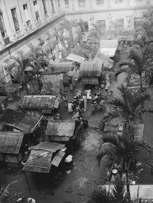 Home For Some 400 Internees -- These rudely constructed shanties at the rear of the Santa Tomas internment camp in Manila, P.I., were the homes of some 400 of the 3,700 internees who were freed by American troops Feb. 5 (Manila Time). The entry of the yanks ended three years imprisonment for the internees. February 13, 1945. (Photo by Associated Press Photo).