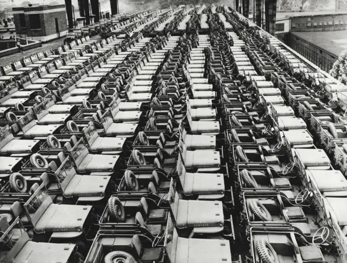 Ready For World Battlefields -- Fast little scout cars of the U.S. Army are massed on the roof of a factory in a Midwest state for shipment to the battlefields of the world. The one-ton "iron horses," rolling by the thousands from an assembly line once devoted to turning out automobiles, arc built from parts supplied by 850 plants scattered throughout the country. November 14, 1942. (Photo by Interphoto News Pictures, Inc.).