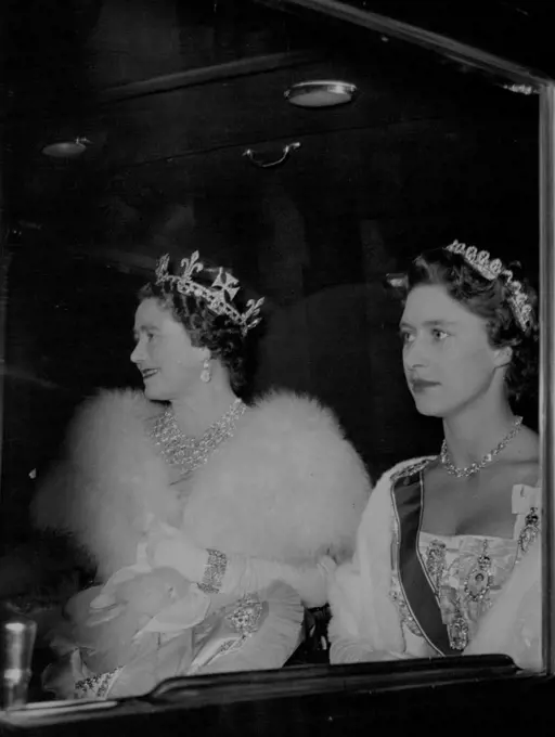 Queen Mother, Princess Margaret, Drive To Banquet For Portuguese President.A graciously smiling Queen Mother, a pensive Princess Margaret, drive in the state coach to the Buckingham Palace banquet.President Craveiro Lopes of Portugal arrived in London with his wife Tuesday on a State Visit, the first such form a Portuguese President for more than half a century. The Portuguese visitors were welcomed on disembarkation at Westminster Pier by Queen Elizabeth and other members of the British Royal Family. During the afternoon President and Madame Lopes went to Britain's historic Westminster Abbey. In the evening they were guests of honor at a state banquet in Buckingham Palace. October 25, 1955. (Photo by Daily Express Picture).