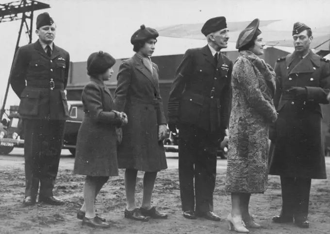 (Right). At an R.A.F. Coastal Command Station, when The King inspected aircraft and quarters and presented awards and decorations. He was accompanied by The Queen, Princess Elizabeth, and Princess Margaret Rose. April 07, 1941.