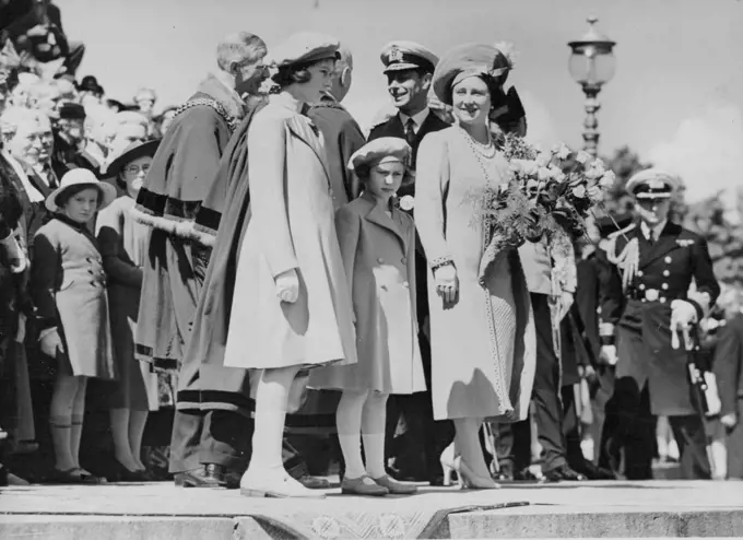 King And Queen Leave Portsmouth for Canada -- The King and Queen with Princess Elizabeth and Princess Margaret on the steps of the Guildhall when the King received the Keys of Portsmouth.As Princess Margaret cried and other members of the Royal family waved good-bye from the dockside, the King and Queen left Portsmouth on the liner "Empress of Australia" for their state Visit to Canada and America. The liner was escorted by Warships. Previously at the Guildhall - revival of an old custom last observed in 1842. May 06, 1939.