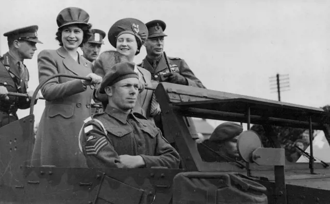 Princess Elizabeth Makes Her First Full-Length Tour Of Inspection -- The Royal Party in a scout car during their inspection of Royal Artillery.On a recent inspection of troops the King was accompanied by the Queen and Princess Elizabeth, it was the first time the Princess had made a Full-length tour with her parents. Scottish troops and armoured infantry were among those visited.The King and Queen and the Princess rode in jeeps their majestics were interested in new developments in the battle organisation of the Royal Army Medical Corps. April 01, 1944. (Photo by British Official Photograph).