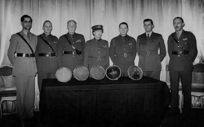 The Princess Royal presents Silver Salvers to Canadian, Australian, South African, New-Zealand and Indian Signal Corps on behalf of the Royal Corps of Signals, at the Hyde Park Hotel. The Group after the presentation, Left to right:- Major M.M. Batra, Indian Signals Corps, Major E.K. Collet, New Zealand Signal Corps, Major General G.G. Rawson C.B., O.B.E., M.C. Col., Commandere of Royal Corps of signals. H.R.H. Princess Royal Col. In-Chief of the Royal Corps of Signals, Lieutement Colonel P.A. Kellough, Royal Canadian Corps of Signals, Major K.R. Colwill Australian Corps of Signals and Major J.C.R. gardner of South African Corps of Signals. January 11, 1946. (Photo by Sports & General Press Agency Ltd.)