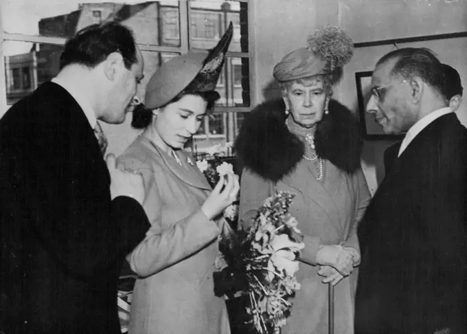 Princess Elizabeth And Queen Mary Visits Diamond Cutters -- Princess Elizabeth is seen examining her 54-carat pink diamond that was given her as a wedding gift by Dr. H.T. Williamson, a Canadian who owns diamond mines in mother, Queen Mary, They are at a diamond cutting factory at clerkenwell green London, today March 10, where the stone is being cut. April 08, 1948. (Photo by Associated Press Photo).