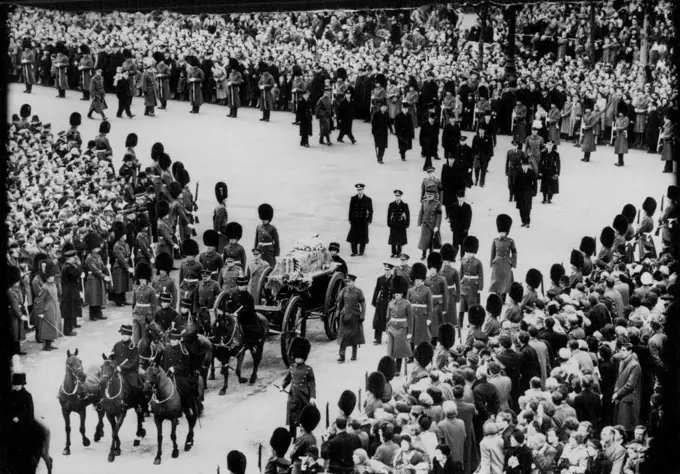 The Funeral Procession of Queen Mary -- The cortege passing from The Mall into the Horse Guards Parade towards Westminster Hall. The body of the late Queen Mary was taken in procession from her residence Marlborough House - to Westminster Hall, where the Lying-in-State will last until the early hours of Tuesday. The coffin will then be taken to Windsor for the burial in St. George's Chapel. March 29, 1953. (Photo by Sport & General Press Agency, Limited).