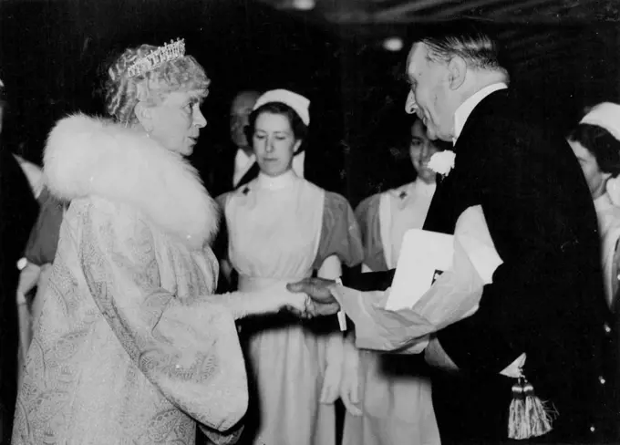 Queen Mary Listens To Gracie Fields -- Queen Mary being greeted by Sir William Goschen at her arrival at the Albert Hall this evening. Gracie Fields, this evening gave her longest stage performance when she sang for more than an hour at the Royal Albert Hall at the Gracie Fields Tribute performance, which was attended by H.M. Queen Mary. October 28, 1938. (Photo by Keystone).