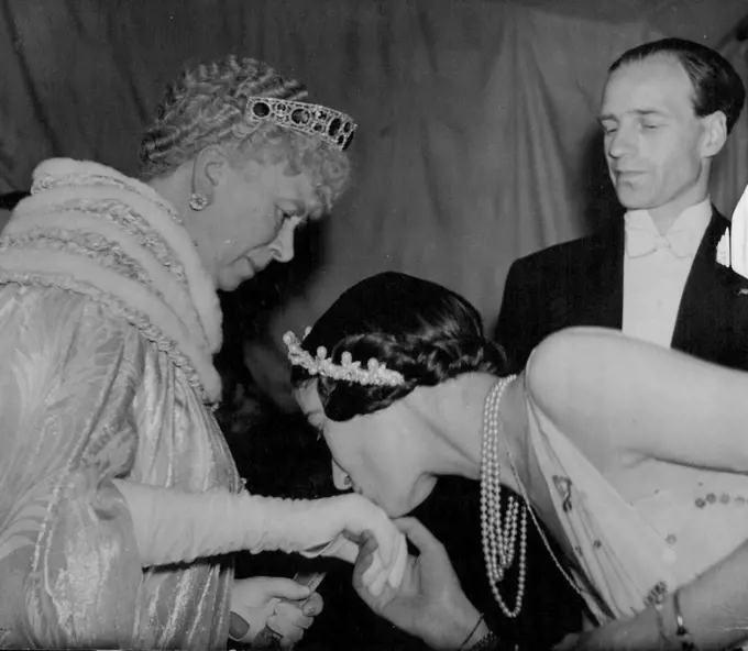 Queen Mary And Duke And Duchess Of Kent Attend Gala Performance At Coliseum -- The Grand Duchess Xenia of Russia kissing Queen Mary's hand on her Majesties arrival at the Theatre. Queen Mary and the Duke and Duchess of Kent this evening attended the gala performance of the Ballets De Monte Carlo, at the Coliseum Theatre in aid of the grand Duchess Xenia of Russia's summer camp for children. May 31, 1937. (Photo by Keystone).