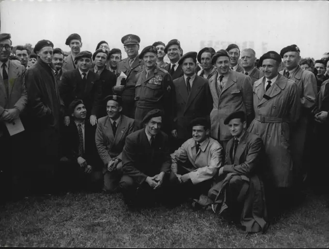 O-Day - Ten Years After - Field Marshal Lord Montgomery with a group of commanders at Ranville. He told the men and families of the Paratroop division that "Ranville is the only place wish to revisit during the annual Pilgrimages and  I will do so every year as long as have life and strength".Ten years ago thousands of British assault troops landed on the beaches of Normandy to begin their task of Liberating Europe. And yesterday thousands of people stood again on those beaches dining Hymns in memory of those who had fought and died at D-Day. June 7, 1954. (Photo by Paul Popper, Paul Popper Ltd.).