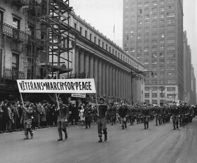 Veterns March In May Day Parade -- A large contingent of Veterns in uniform swing down Eight Revenue, New York City, May 1, in the first May Day Parade in New York since 1941. Some 200 former soldiers and 100 former sailors took part. The parade was orderly and ended in a Massed celebration in Union Square. May 1, 1946. (Photo by Associated Press Photo).