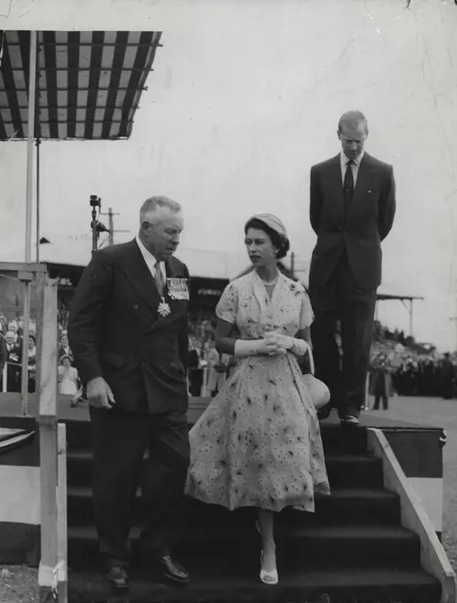Rally: The Queen descends the dais with Major General Richardson after the Duke (in background) had addressed ex-servicemen at Newcastle Showground. February 10, 1954.