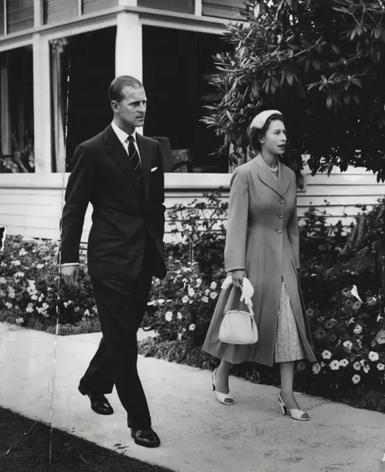 Rest Day - The Queen and Duke of Edinburgh walk in the grounds of O'Shannassy Chalet (Victoria) yesterday when the Royal couple had a day free of official engagements. March 9, 1954.