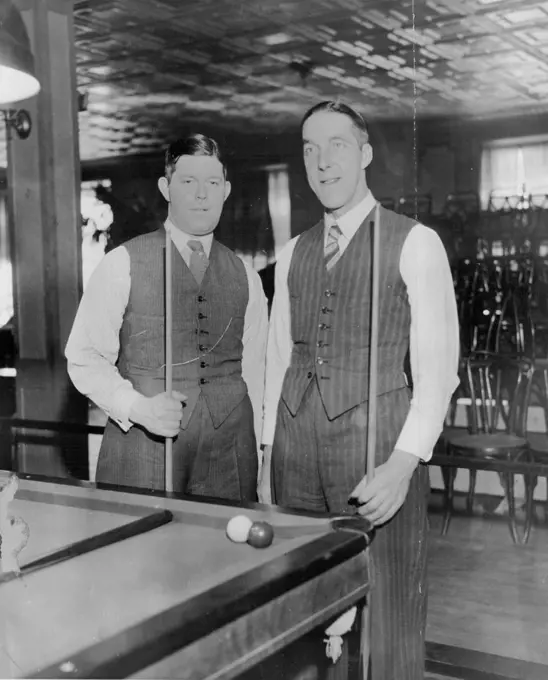 Engaged in Handicap Match in New York City - Walter Lindrum of Australia, world's champion at English Billiards, left, and Tom Newman, six times English champion and Former world's Titleholder, photographed in New York City April as they continued their 12-session handicap billiard match. Lindrum was leading April 6, winning both the fifth and Sixth Sessions. July 04, 1932. (Photo by Associated Press Photo).
