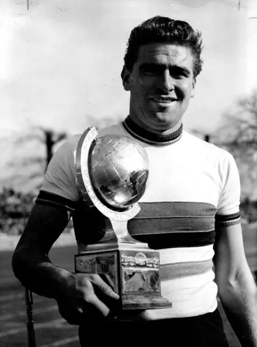 Champion of Champions: Syd Patterson holds the "Champion of Champions" trophy which he won in the international sprint race over 1,000 metres at the Good Friday meeting at London's Herne Hill, Apr. 7, 50 December 9, 1953. (Photo by Associated Press Photo).