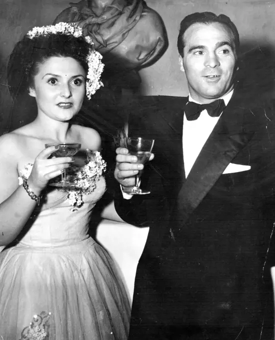 Fistic Royalty. Marcel Cerdan, French Middle weight king, and his lovely wife were ***** those present. January 1, 1948. (Photo by Acme Photo).