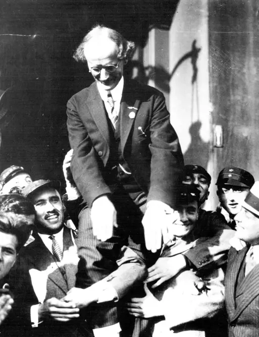 The Hero Of The Stratosphere Flight -- Prof. Piccard, the famous scientist Ballonist being carried off on the shoulders of Admirers on his arrival in Brussells, Crown Prince Leopold and others of the Royal Household were at the station to welcome Prof. Piccard after his marvelous ascent into the heavens in the specially built balloon which reached. A height of nearly ten miles. August 06, 1931. (Photo by International Newsreel Photo).