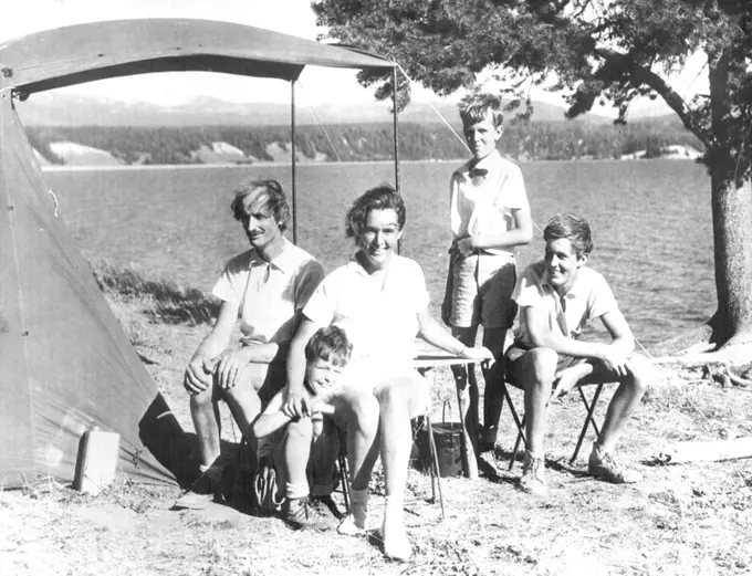 Fresh Air Enthusiasts -- Dr. and Mrs. Jean Piccard, former holders of the stratosphere altitude record, and their three sons vacationing in the open. They are shown on the shore of lake Yellowstone, a wind-swept campsite to be sure. The sons are Donald(left), Paul (Center), and John (Right). August 13, 1935. (Photo by Associated Press Photo).