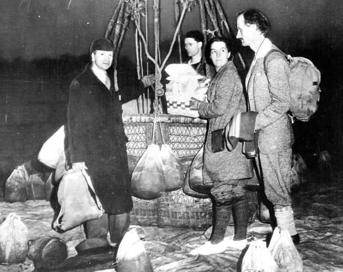 Mrs. Piccard Trains For Stratosphere Flight -- Mrs. Jeannette Piccard, who is training for a flight into the stratosphere with her husband, Professor Jean Piccard, is shown with her husband, at right, and Edward J. Hill (left), well known balloonist, just before they took off on a training flight at Detroit, May 16. Her balloon, which left at Daylight, was forced down on a farm near Thomasville, Ont., later in the day by high winds. May 16, 1934. (Photo by Associated Press Photo).