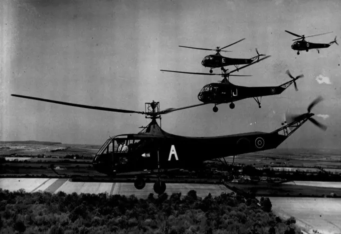 Helicopters Are Here To Stay: The R.A.F.'s "Go Any Way" Service -- A formation of R.A.F helicopters in flight Andrews Planet Apr. 23 1945 PN Censor Nos.Rising vertically from the ground or rooftop, flying backwards, forwards or sideways, and hovering to drop or pick up passengers, the Sikorsky R4B helicopter, now contributing to the development of an R.A.F. helicopter service, has shown that these aircraft, with till notable advantages for special purposes, will play en important part in Britain's aerial activities after the war. These photographs were taken during training at an R.L.F. school,. end for the first time in history shore helicopters flying and hovering in formation. April 23, 1945.