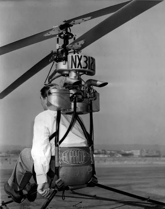 Air Motorcycle -- A rear view of the "Hoppicopter" showing the left hand of the inventor, Horace Pentecost on the gas throttle. The pilot is strapped in just as in convention all planes. July 29, 1946. (Photo by Wide World Photos).