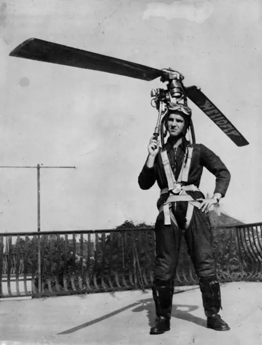 Everybody Can Wear His Own Autogyro, Take Off In Street -- Paul Baumgartl wearing the 'Heliofly'. The 'Heliofly', a device which, strapped to the body, enables the wearer to take off in the street, climb to an altitude of 3,000 feet and fly Baumgartl, a 28-year-old Viennese technician, after three years' experiment and trial. The apparatus consists of an air screw resembling an autogyro's, and a motor; total weight does not exceed 30 pounds. Baugartl says he is going to start mass production of the 'Heliofly' as soon as the Allied occupation authorities permit powered aviation in Australia. October 24, 1946.